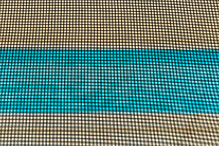 View of a pool through a mandatory safety net on the edges of a private psicine