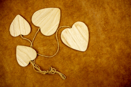 wooden hearts on vintage background for Valentine's day or love celebration conceptの写真素材