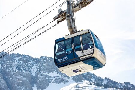 La Mongie, France - March 23, 2019:The cable car from La Mongie with tourists inside up to the Pic du Midi at an altitude of 2900 metersのeditorial素材