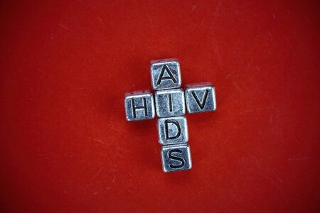 VIH - AIDS disease background concept represented by cubic metal letters