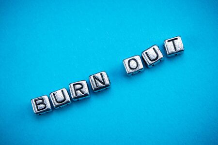 Burnout background concept represented by cubic metal letters
