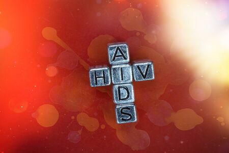 VIH - AIDS disease background concept with cubic metal letters and blood backgroundの写真素材