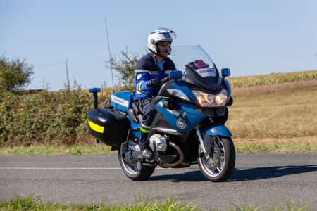 Benon, France - September 9, 2020: biker of the French gendarmerie on a country road in escort during the tour de france cyclistのeditorial素材