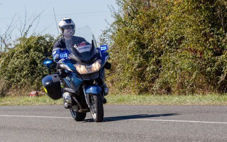 Benon, France - September 9, 2020: biker of the French gendarmerie on a country road in escort during the tour de france cyclistのeditorial素材
