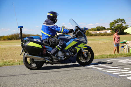 Benon, France - September 9, 2020: biker of the French gendarmerie on a country road in escort during the tour de france cyclistのeditorial素材