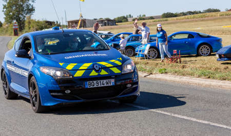 Benon, France - September 9, 2020: Gendarmerie patrol on a country road in escort during the tour de france cyclistのeditorial素材