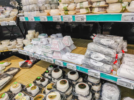 La Rochelle, France - October 3, 2020: Random sorts of traditional French cheese for sale on supermarketのeditorial素材