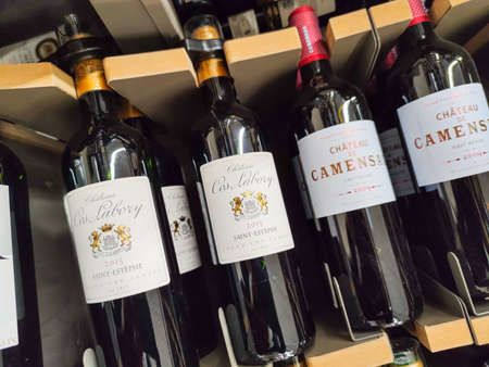 Builboreau, France - October 14, 2020: Row of Saint-Estephe Bottles, Classified Growths bottles...