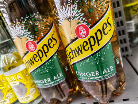 Puilboreau, France - October 14, 2020: Row of schweppes ginger soft drink bottle's display for sell...