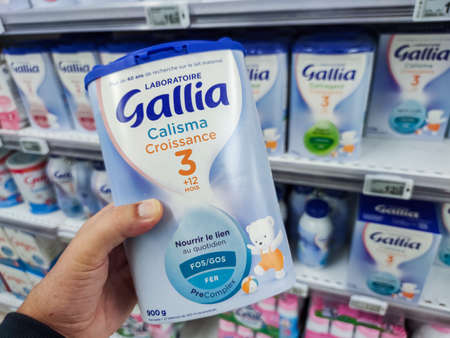 Puilboreau, France - October 14, 2020: A consumer chooses a box of Gallia brand baby milk from the...
