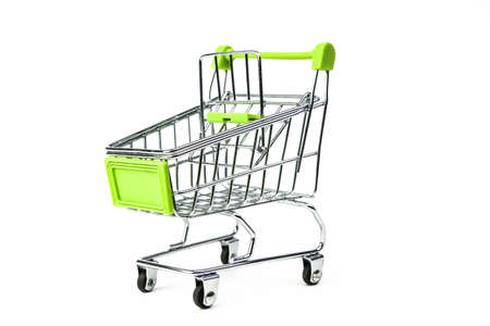 closeup on supermarket shopping cart isolated on white backgroundの写真素材