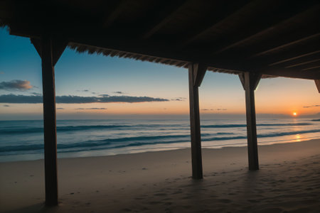 Sunrise over a tranquil, deserted beachの素材