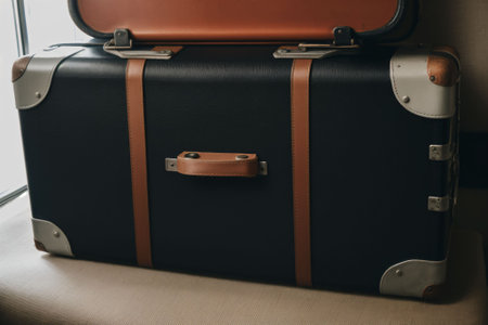 Detail of a vintage suitcase with travel stickersの素材