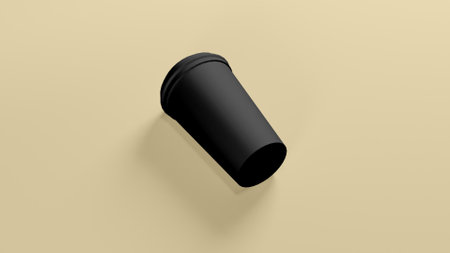 Black Colored Hot Coffee Cup in Yellow Backgroundの写真素材