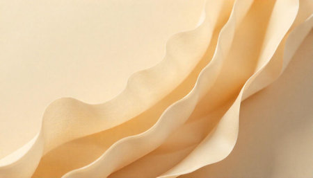 Abstract cream folds and waves background texture close up