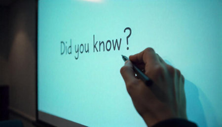 Hand writing Did You Know question on illuminated screen