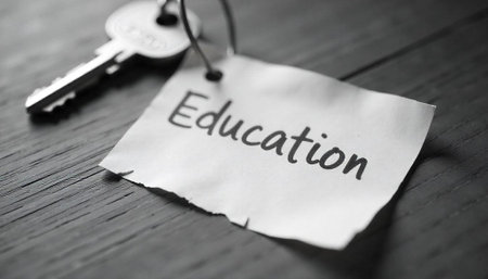 Key to education displayed on desk in monochrome tonesの写真素材