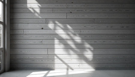 Minimalist grey wood paneling interior with sunlight and shadowの写真素材