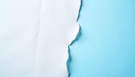 Ripped white paper revealing a contrasting blue background