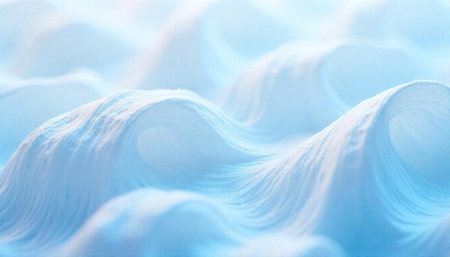 Abstract flowing white fabric waves illuminated by soft lightingの写真素材
