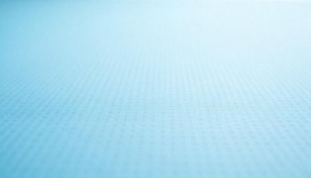 Light blue textured surface with subtle dot pattern backgroundの写真素材