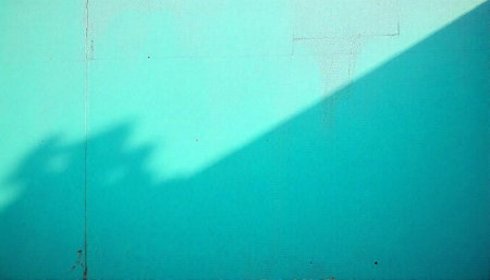 Minimalist turquoise wall with shadow and vintage texture