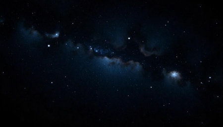 Deep space nebula with bright stars and dark cloudsの写真素材