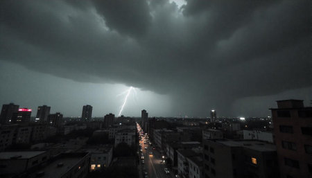 Lightning Strike Illuminates Cityscape Under Ominous Storm Clouds