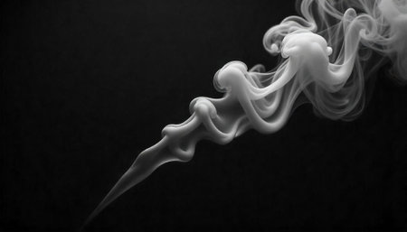 Abstract smoke trail on black background forming flowing shapesの写真素材