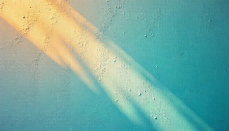Textured diagonal sunlight over turquoise painted canvas backdrop image
