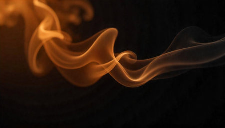 Abstract orange smoke swirls against a stark black backgroundの写真素材