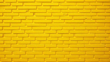 Vibrant yellow brick wall offers a versatile backdrop textureの写真素材