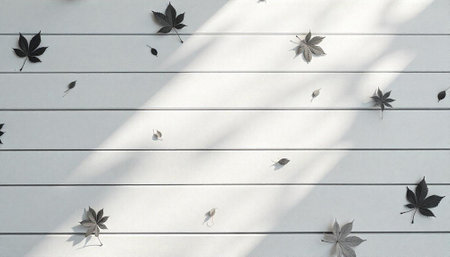 Autumn leaves on white wooden surface in sunlight shadows
