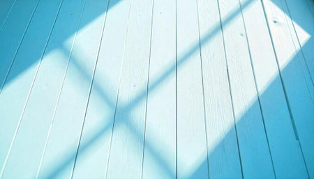 Light blue wooden planks with a beam of sunlightの写真素材