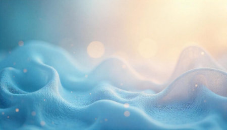 Elegant blue fabric flowing with soft lighting and bokehの写真素材