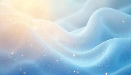 Soft, flowing blue fabric with golden light highlights texture