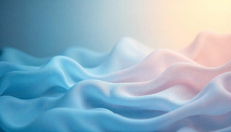 Soft pastel fabric drapes in a dreamy wavy patternの写真素材