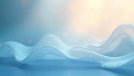 Abstract flowing light blue fabric with small light effectsの写真素材