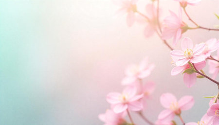 Soft pink flowers blossoming on branches with pastel background