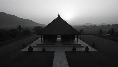 Monochrome hut landscape with mountains and palm trees backdrop