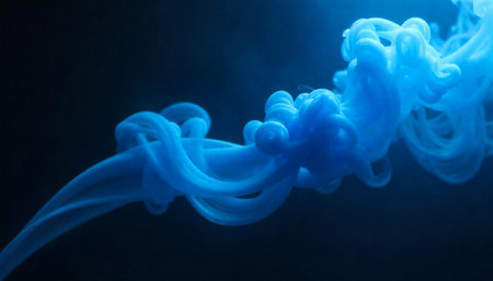 Abstract blue ink cloud on dark background rising up