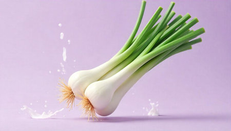 Fresh green onions with milk splash on purple backdrop