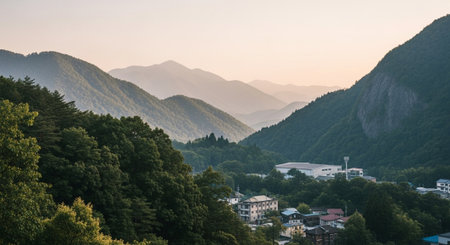 Scenic mountain landscape with layered hills and small townの写真素材