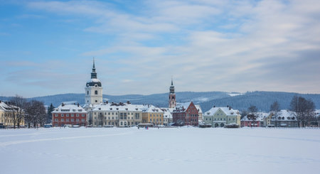 Winter cityscape with snow covered buildings and clear skyの写真素材