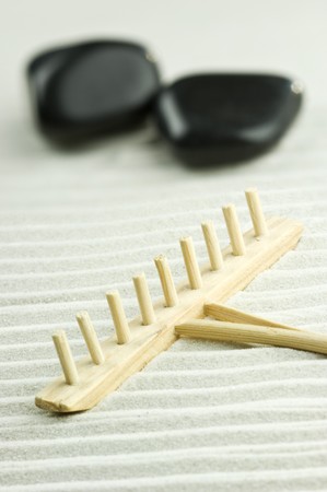 Miniature of a Zen garden with two stones and wooden rakeの写真素材