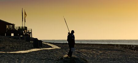 Fisherman in the dawnの写真素材