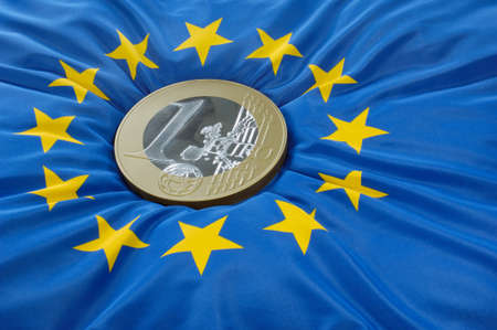 Euro coin on a european flag
