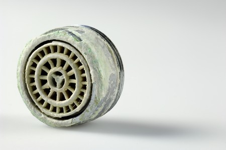 Calcified sieve of a faucet in close upの写真素材