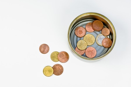 Small change collected in a tin