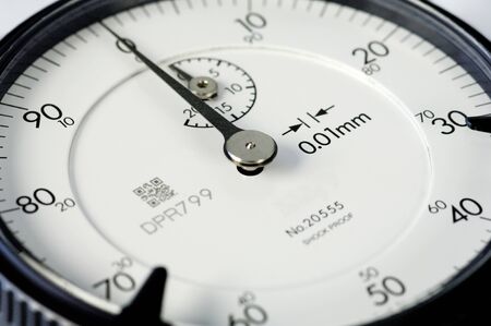 White face of a dial gauge, manual measuring instrumentの写真素材